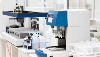 A laboratory featuring a machine designed for testing various samples